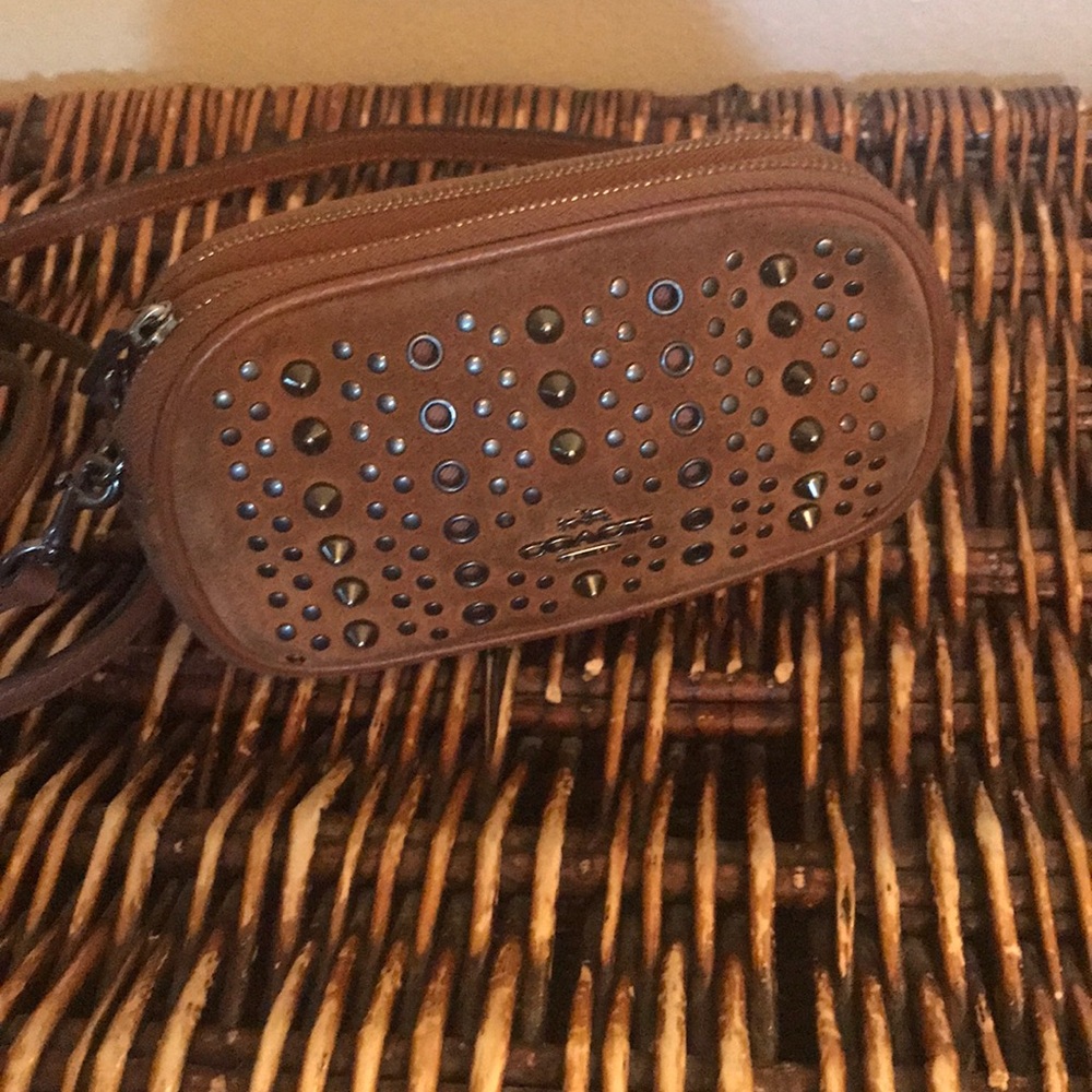 Coach w RIVETS used 2 zip clutch with strap .
